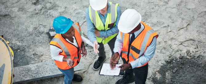 Construction contractors reviewing surety bond documents