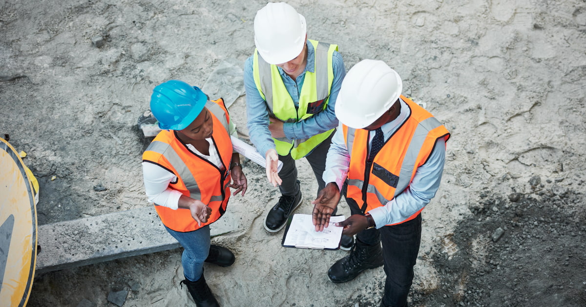 Construction contractors reviewing surety bond documents